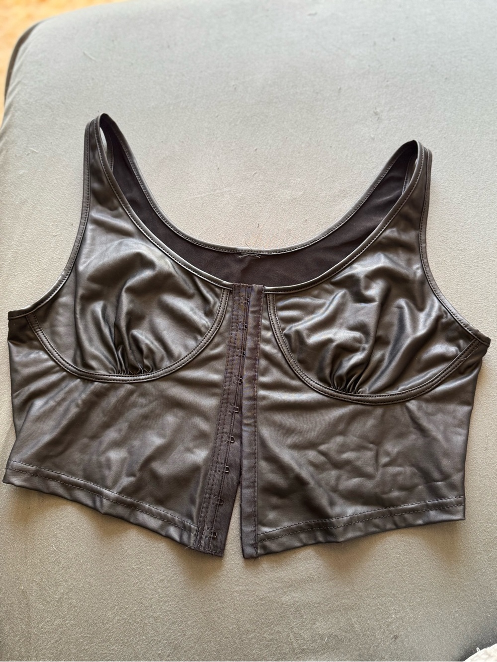 Sleek Faux Leather Front-Closure Crop Top in Black